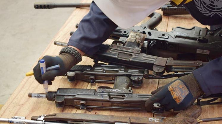 Guns being marked on a table
