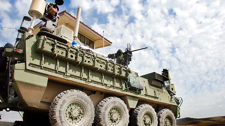Laser system mounted on an armoured vehicle