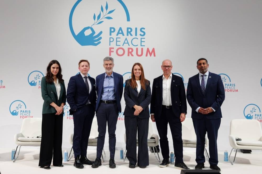 What risks will artificial general intelligence and the race for tech domination pose?