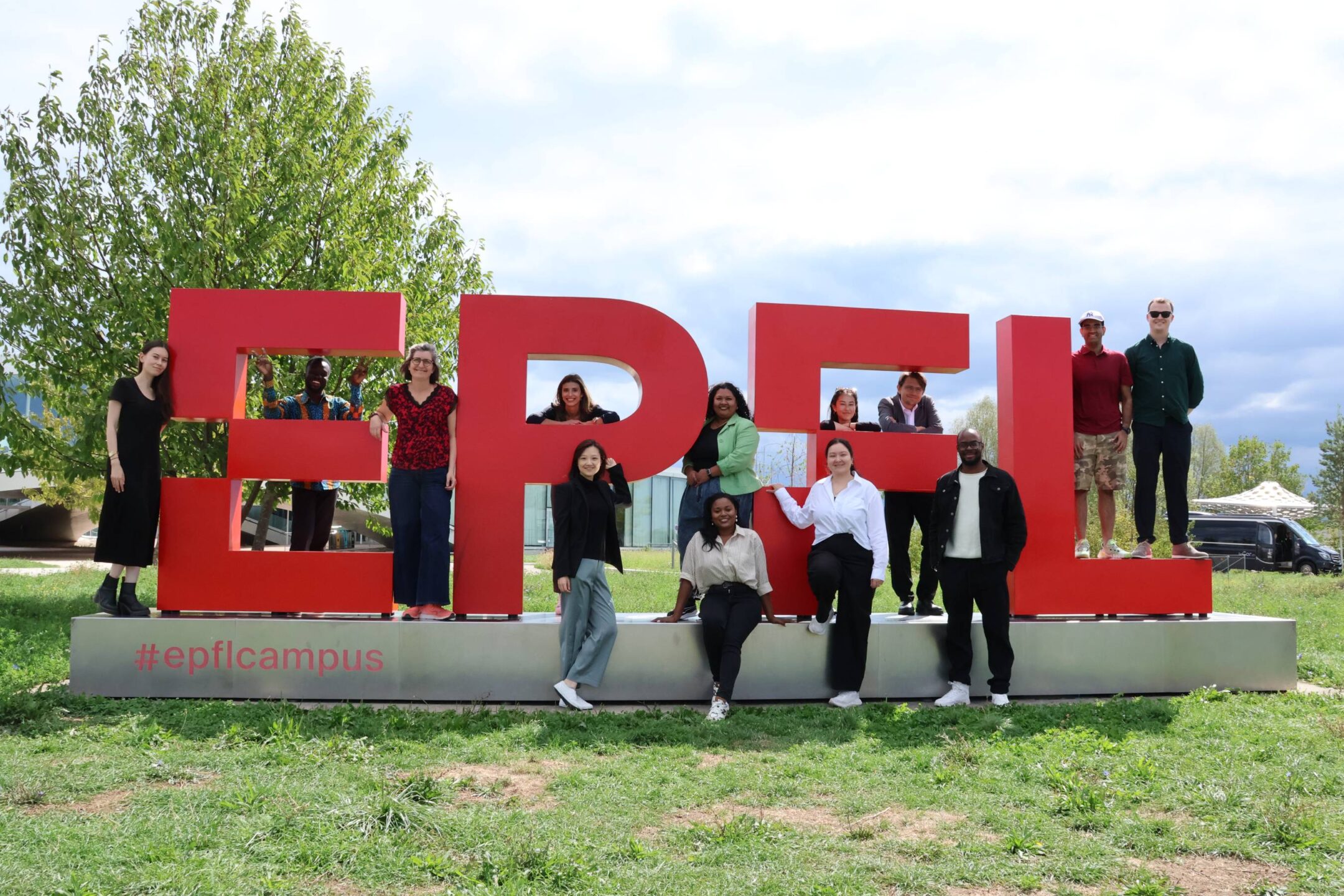 UNIDIR Space Security Research Fellows posing beside the EPFL sign in Lausanne.