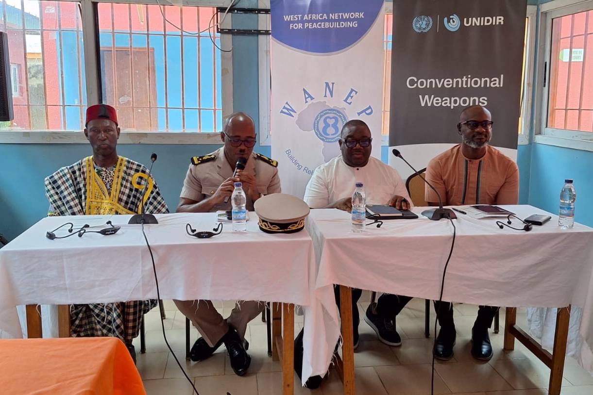 Four speakers, including a traditional leader and a local official in uniform, on the panel at the UNIDIR and WANEP training on preventing ammunition diversion and trafficking in Ouangolodougou, Côte d’Ivoire.