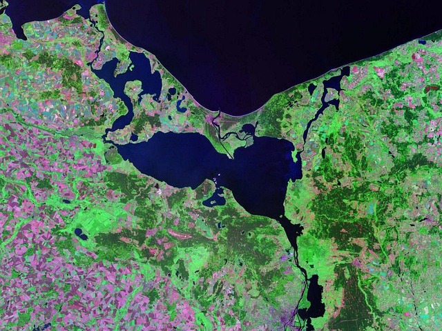 Satellite view of the Szczecin Lagoon and Pomeranian Bay coastline on the Baltic Sea, illustrating how Earth observation satellites collect data on territories from orbit.